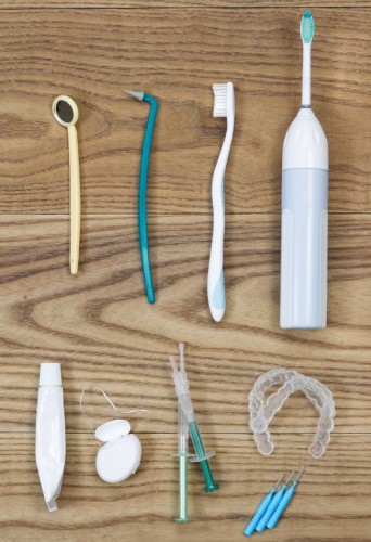 A variety of tooth care items such as floss, toothbrushes and mirrors