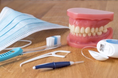 A pile of dental items including floss, toothbrush and picks